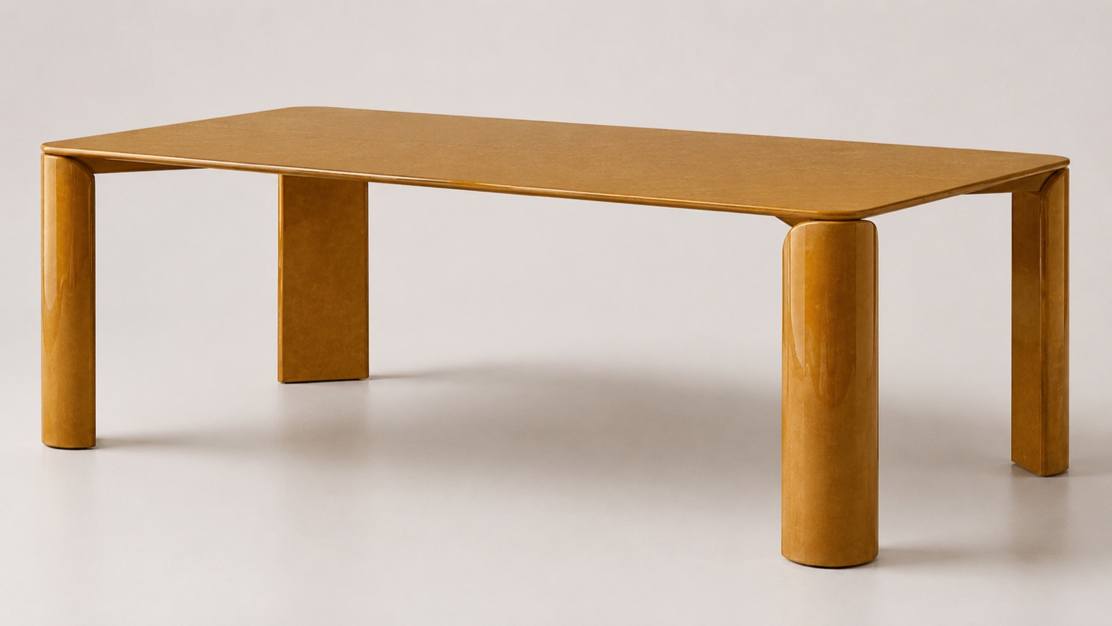 Monolite dining table in ochre lacquer